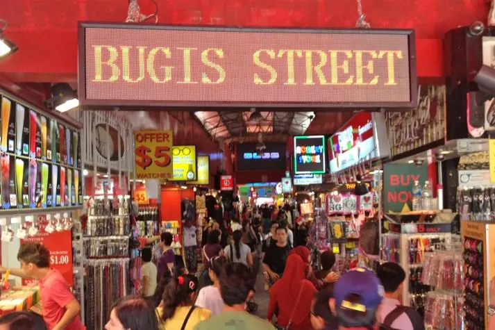 Shoppers under the Bugis Street sign